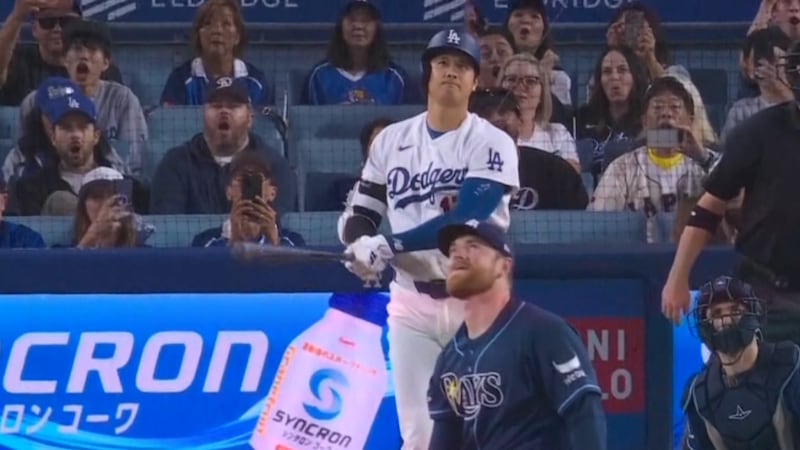 The Tampa Bay Rays' Drew Rasmussen surrenders a solo home run to the Los Angeles Dodgers'...