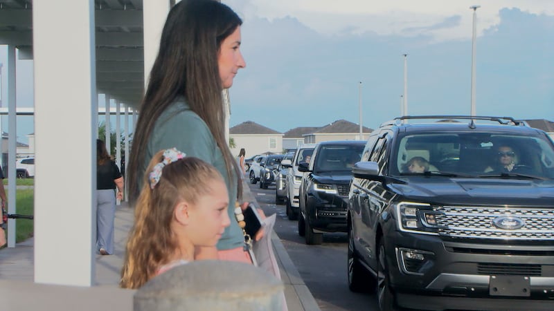 Parents line up to drop off their kids at Lake Manatee K-8, a new school in Lakewood Ranch.