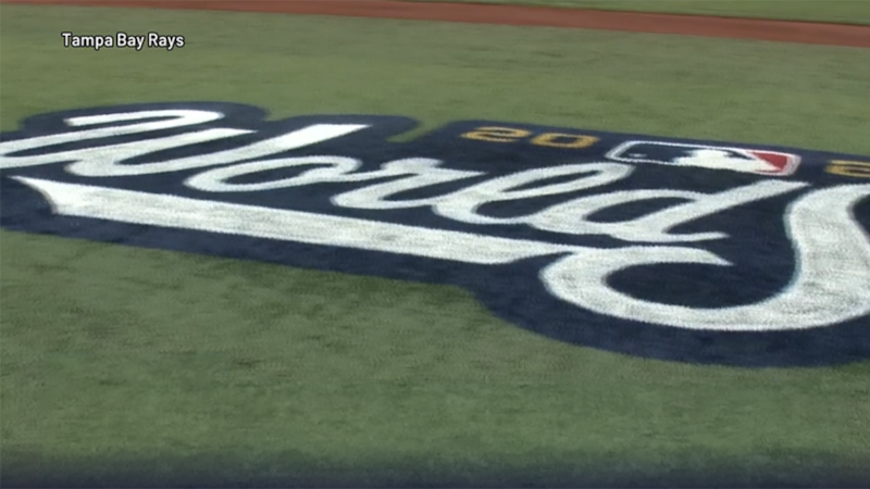 Crews at Tropicana Field put up new World Series banners and painted the World Series logo on...