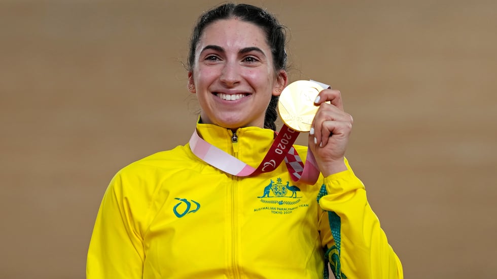 FILE - Paige Greco of Australia holds her gold medal after winning the Cycling Track Women's...
