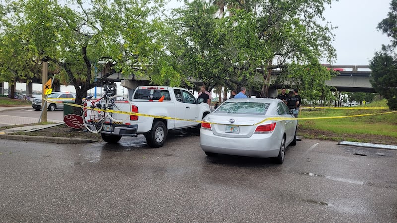 Police secure the area in the parking lot at Bradenton's Riverwalk Monday after a road rage...